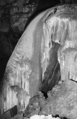 Photo of flowstone formation that looks like a frozen waterfall.